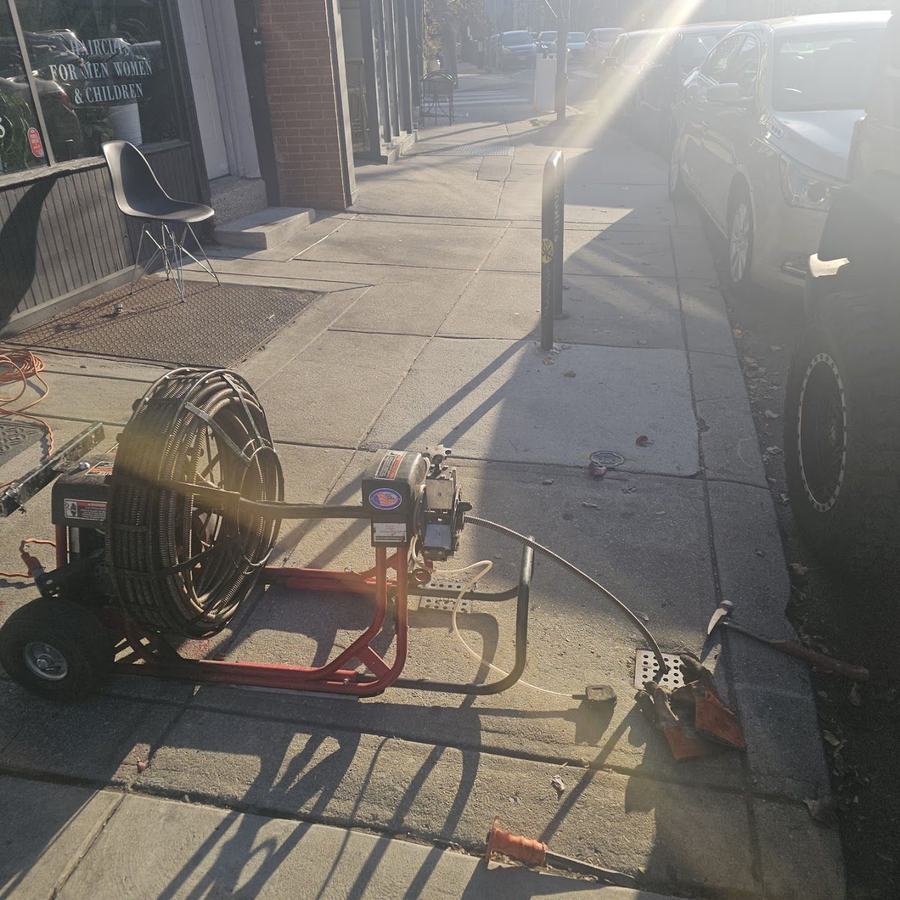 Drain cleaning machine set up on a Philadelphia sidewalk