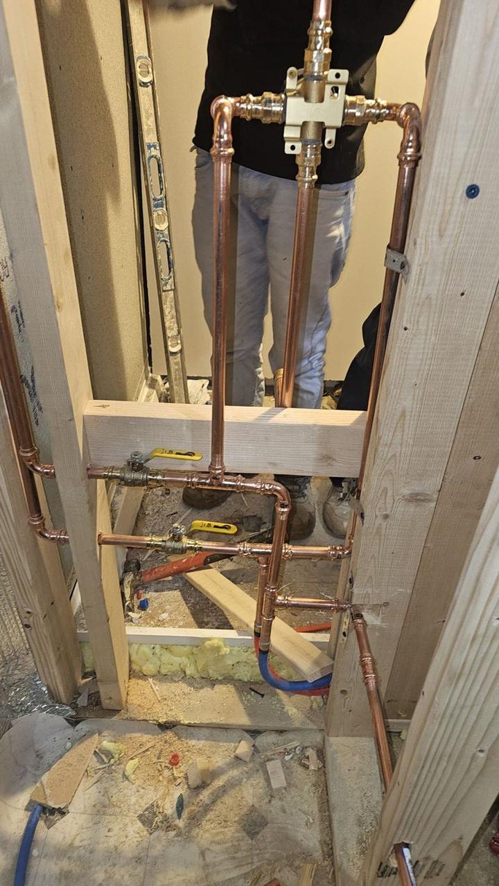 Copper supply lines being installed in an open wall