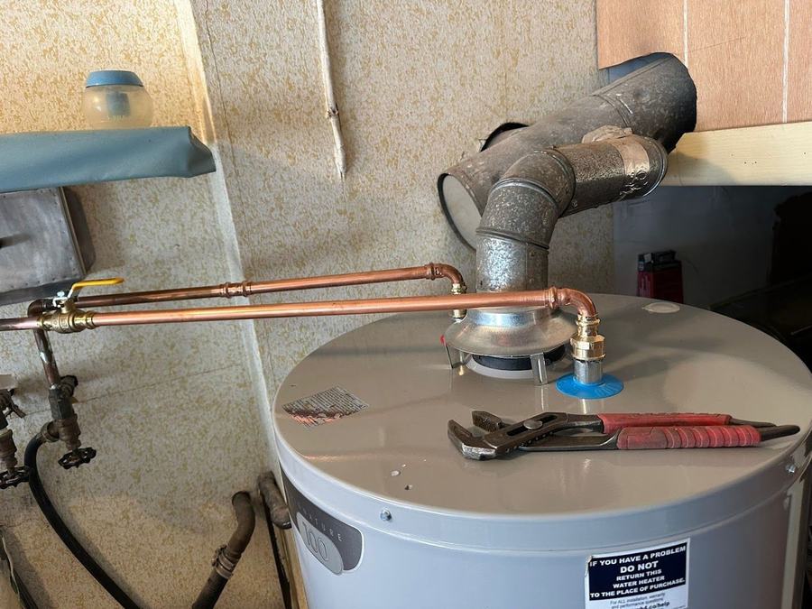 Newly installed water heater with copper piping and vent